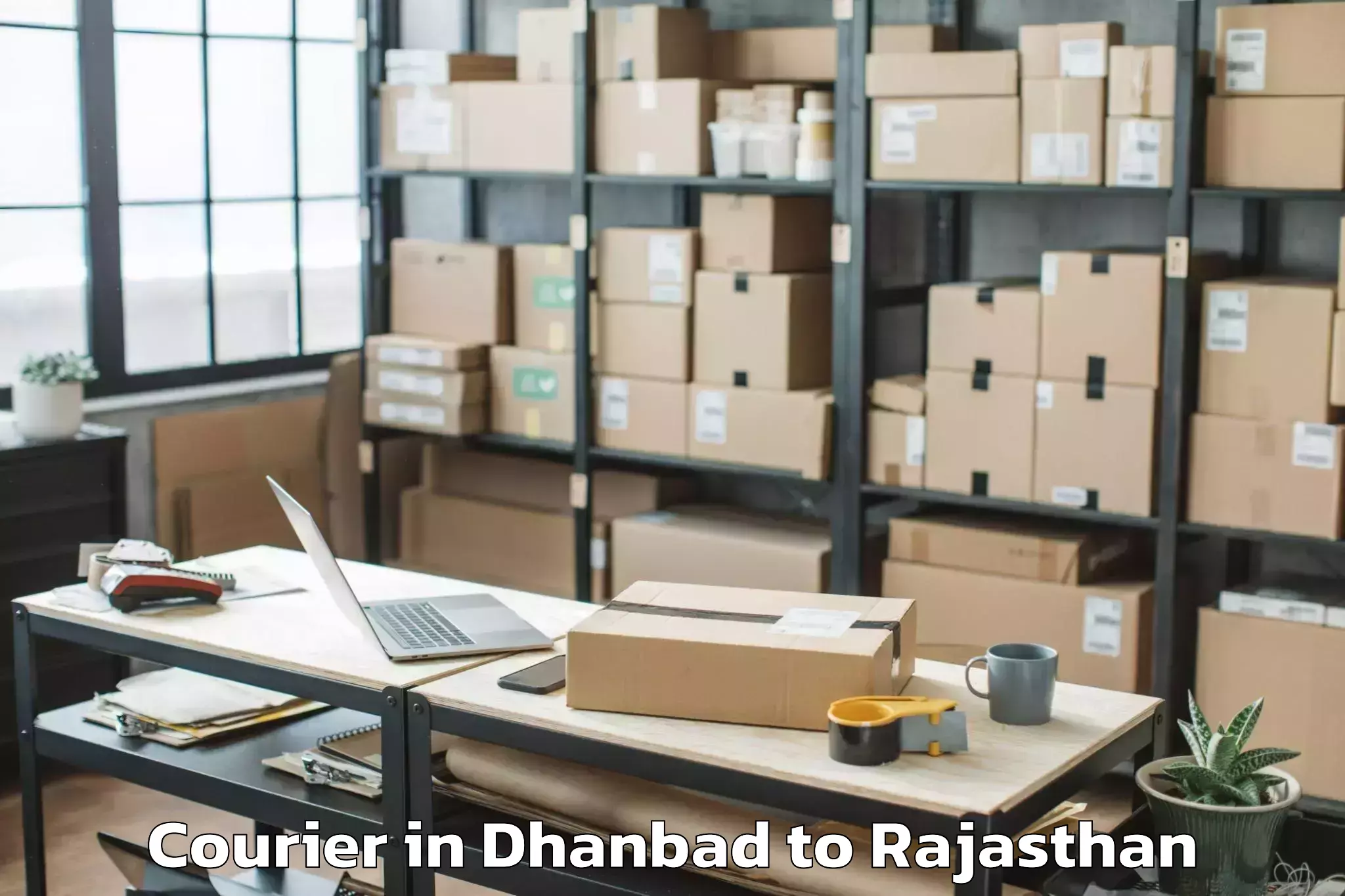 Book Your Dhanbad to Maharaja Ganga Singh Universit Courier Today